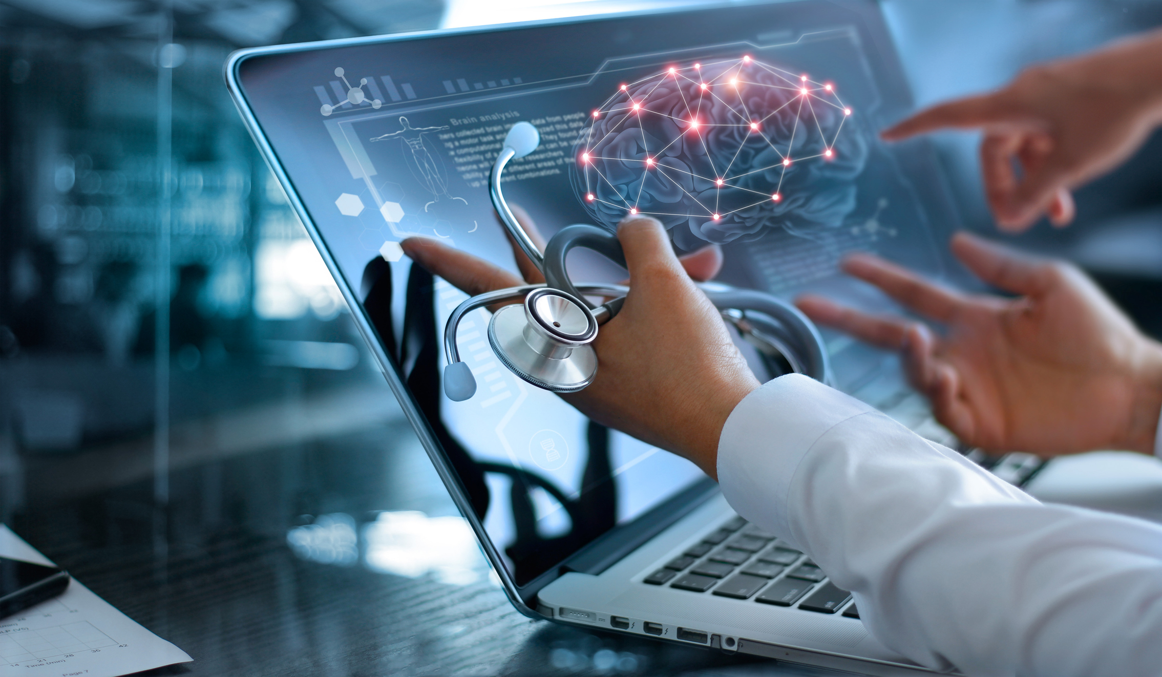 Closeup of neurologists examining detailed brain scans during a functional neurology appointment