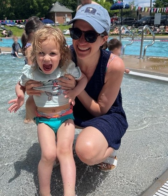 Carla and Tessa Karp smiling poolside