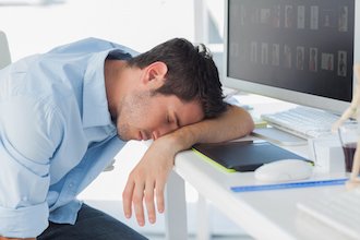 man sleeping on desk